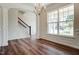 Bright dining area with hardwood floors, white wainscoting, chandelier, and large windows at 0 Sawmill, Cedar Grove, NC 27231