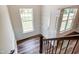 Open foyer area with hardwood floors, white wainscoting, and great natural light at 0 Sawmill, Cedar Grove, NC 27231