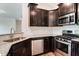 Modern kitchen showcases stainless steel appliances, granite counters, and stylish cabinetry at 0 Sawmill, Cedar Grove, NC 27231
