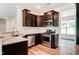 Stainless steel appliances complement the granite countertops and dark cabinetry in kitchen at 0 Sawmill, Cedar Grove, NC 27231