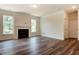 Spacious living room featuring a fireplace, large windows, and modern hardwood flooring at 0 Sawmill, Cedar Grove, NC 27231