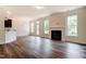 Bright living room features a fireplace, modern flooring, and large windows at 0 Sawmill, Cedar Grove, NC 27231