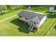 Home with a metal roof, spacious yard, storage shed, and back deck at 1017 S Second Ave, Siler City, NC 27344