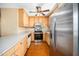 A kitchen featuring stainless steel appliances and wooden cabinets at 1017 S Second Ave, Siler City, NC 27344
