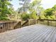 Back deck with wood railing overlooking the backyard at 103 Wesker Cir, Durham, NC 27703
