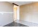 Unfinished room with patterned linoleum flooring and visible wall studs at 103 Wesker Cir, Durham, NC 27703