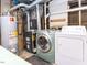 Close-up of basement laundry area with water heater at 103 Wesker Cir, Durham, NC 27703