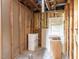 Unfinished basement area with storage shelving and exposed ceiling framing at 103 Wesker Cir, Durham, NC 27703