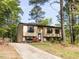 Charming split-level home featuring a well-maintained lawn and beautiful landscaping at 103 Wesker Cir, Durham, NC 27703