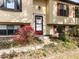 A welcoming front entrance is surrounded by a vibrant garden at 103 Wesker Cir, Durham, NC 27703