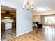 Open-concept layout showing kitchen access, dining area, and hardwood floors at 103 Wesker Cir, Durham, NC 27703