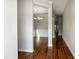 Inviting hallway with hardwood floors leads to a dining area with a chandelier at 104 Mainline Sta, Morrisville, NC 27560