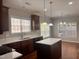 Kitchen offering natural light, dark cabinetry, and a center island for additional prep space at 104 Mainline Sta, Morrisville, NC 27560