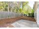 Concrete patio and privacy fence in backyard of this home at 104 Mainline Sta, Morrisville, NC 27560