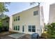 Backyard featuring a patio and view of the two-story home exterior at 104 Mainline Sta, Morrisville, NC 27560