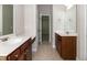 Bathroom features double sink vanity with dark wood cabinetry at 104 Mainline Sta, Morrisville, NC 27560