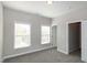 This bedroom has two windows and a doorway leading to the hallway at 104 Mainline Sta, Morrisville, NC 27560