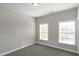A brightly lit bedroom with two large windows providing an abundance of natural light at 104 Mainline Sta, Morrisville, NC 27560