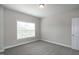 Bedroom featuring neutral walls, carpeted floors, a window, and base trim at 104 Mainline Sta, Morrisville, NC 27560