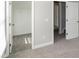 This carpeted bedroom has a closet, doorway, and two windows with natural light at 104 Mainline Sta, Morrisville, NC 27560