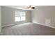 Neutral bedroom with natural light, ceiling fan, and closet access at 104 Mainline Sta, Morrisville, NC 27560