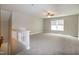 Spacious carpeted bonus room features abundant natural light from a large window at 104 Mainline Sta, Morrisville, NC 27560