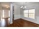 Elegant dining room with beautiful hardwood floors, decorative chandelier, and natural light at 104 Mainline Sta, Morrisville, NC 27560