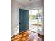 Inviting entryway featuring hardwood floors, a blue front door, and bright natural light at 104 Mainline Sta, Morrisville, NC 27560