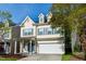 Charming two-story home with attached garage and manicured front lawn at 104 Mainline Sta, Morrisville, NC 27560