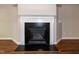 Close-up of the fireplace with a decorative mantle, creating a cozy focal point in the room at 104 Mainline Sta, Morrisville, NC 27560