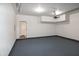 Clean, open two-car garage featuring an automatic door and epoxy flooring at 104 Mainline Sta, Morrisville, NC 27560