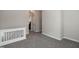Upper loft area with plush carpeting, views of the staircase, and natural light at 104 Mainline Sta, Morrisville, NC 27560