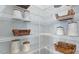 Well-organized pantry with wire shelving for ample storage, woven baskets and neutral decor at 105 Sepals Pl, Wendell, NC 27591