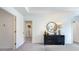Bright bedroom features a black dresser with a round mirror and a walk-in closet at 107 Sepals Pl, Wendell, NC 27591