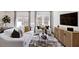 Modern living room featuring white sofas, a patterned rug, and a wooden media center under a wall-mounted television at 107 Sepals Pl, Wendell, NC 27591