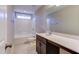 Bathroom featuring single vanity with dark cabinets, white countertop, bathtub, and tile floors at 1073 Fairhaven Dr # 52, Mebane, NC 27302