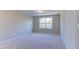 Neutral carpeted bedroom featuring a large window that brings in ample natural light at 1073 Fairhaven Dr # 52, Mebane, NC 27302