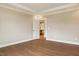 Spacious bedroom with hardwood floors, featuring an ensuite bathroom and ample natural light at 1073 Fairhaven Dr # 52, Mebane, NC 27302