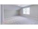 Neutral bedroom with a window and plush carpet at 1073 Fairhaven Dr # 52, Mebane, NC 27302