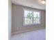 Cozy bedroom with neutral carpet and a large window offering natural light at 1073 Fairhaven Dr # 52, Mebane, NC 27302