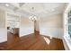 Elegant dining room with coffered ceilings, hardwood floors, and wainscoting with an open layout at 1073 Fairhaven Dr # 52, Mebane, NC 27302