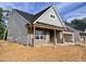 Side view of an attractive home with brick and vinyl siding and unfinished yard at 1073 Fairhaven Dr # 52, Mebane, NC 27302
