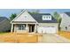 Charming brick home with a two-car garage and stylish gray shutters at 1073 Fairhaven Dr # 52, Mebane, NC 27302