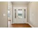 Bright foyer with hardwood floors and charming front door with side windows at 1073 Fairhaven Dr # 52, Mebane, NC 27302