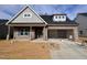 Charming brick home with gray shingles, two-car garage, and unfinished landscaping at 1073 Fairhaven Dr # 52, Mebane, NC 27302