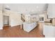 Bright, spacious kitchen with a large center island, modern appliances, and hardwood floors at 1073 Fairhaven Dr # 52, Mebane, NC 27302