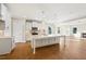Open kitchen featuring white cabinetry, large island, and stainless steel appliances at 1073 Fairhaven Dr # 52, Mebane, NC 27302