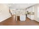 Spacious kitchen featuring a large island, stainless steel appliances, and staircase at 1073 Fairhaven Dr # 52, Mebane, NC 27302