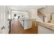 Modern kitchen featuring a large island, stainless steel appliances, and a view of the living room at 1073 Fairhaven Dr # 52, Mebane, NC 27302