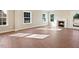 Sun-filled living room with hardwood floors, fireplace, and multiple windows at 1073 Fairhaven Dr # 52, Mebane, NC 27302